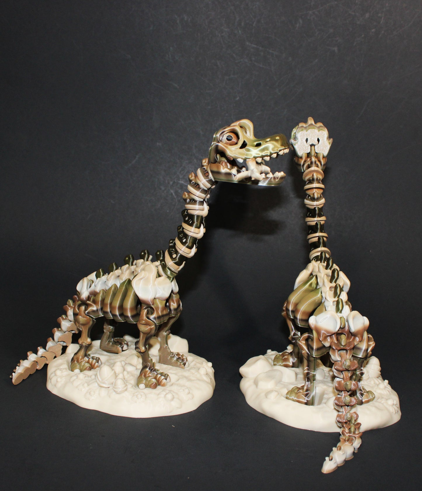 A 3D-printed articulated Brachiosaurs skeleton includes a stand and branch. 7.5" Tall