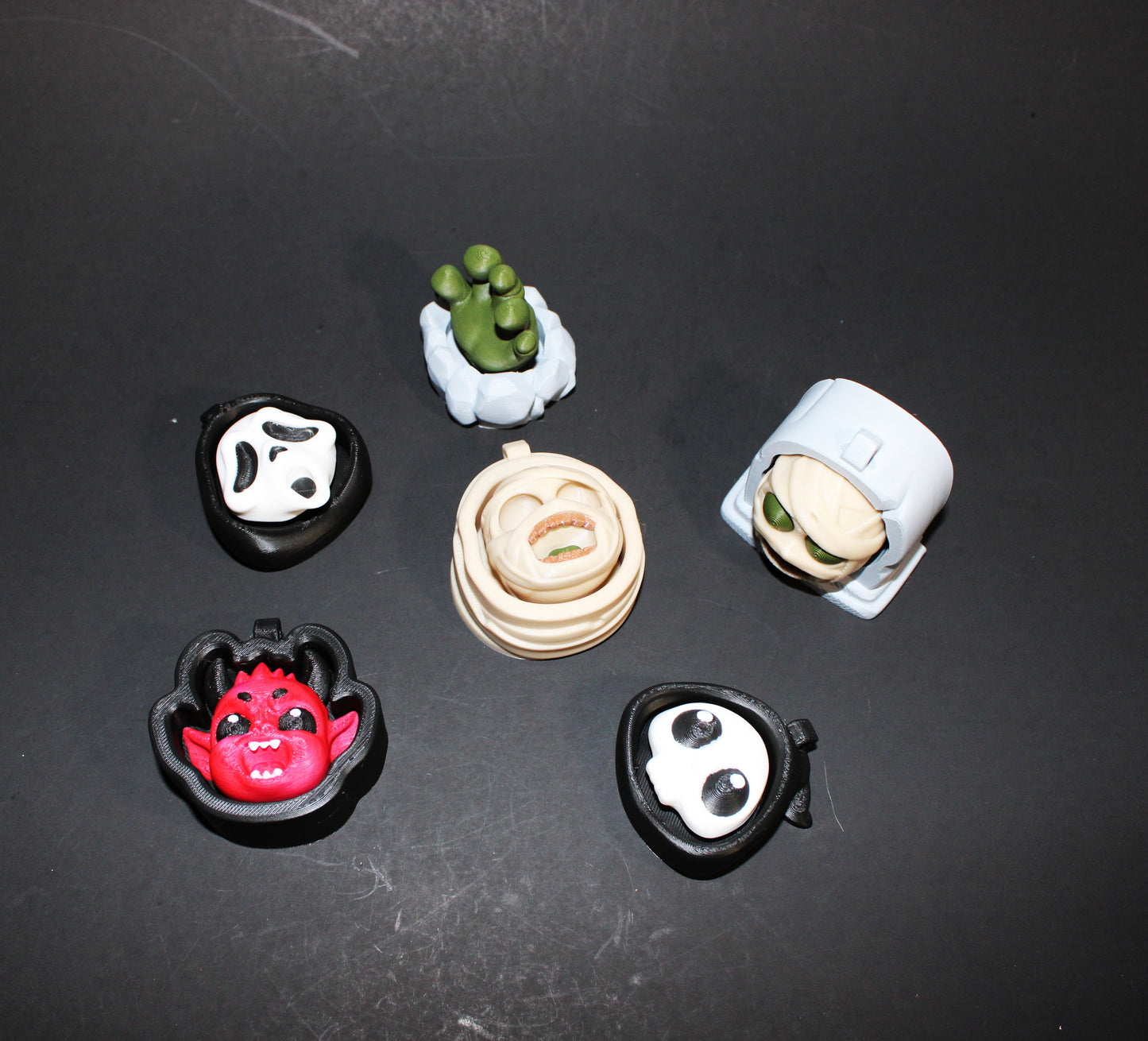 3D-printed Halloween keychain clickers, 2 inches.