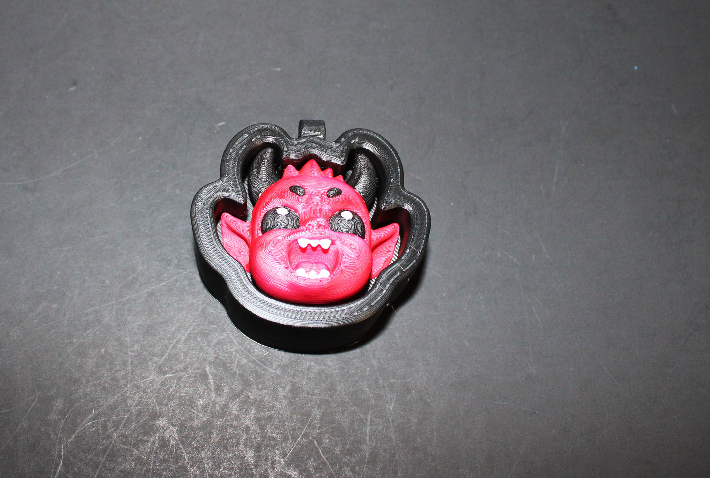 3D-printed Halloween keychain clickers, 2 inches.
