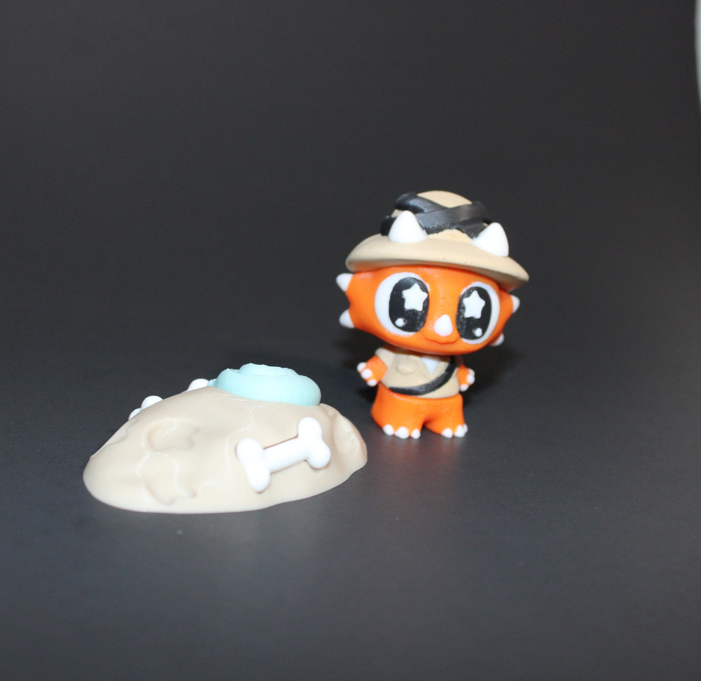 3D Printed Flexi Triceratops Archeologist with fossil