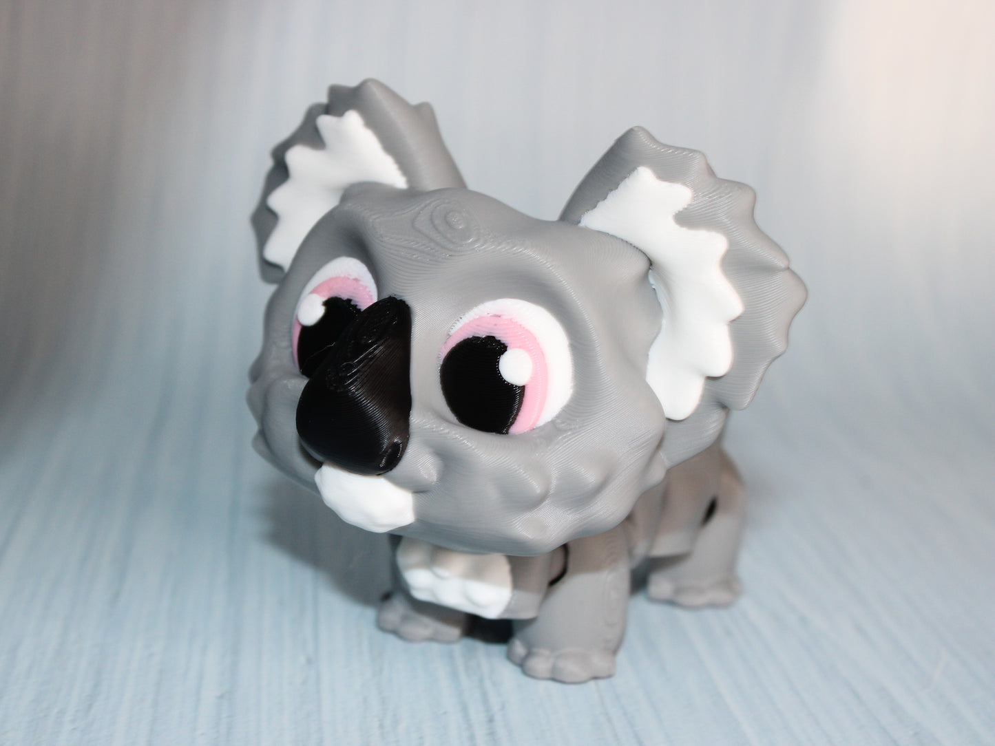 Awareness or Flower Koala – 3D printed, measuring 4.5" long by 3.5" tall. - Wonderland 3D Printing
