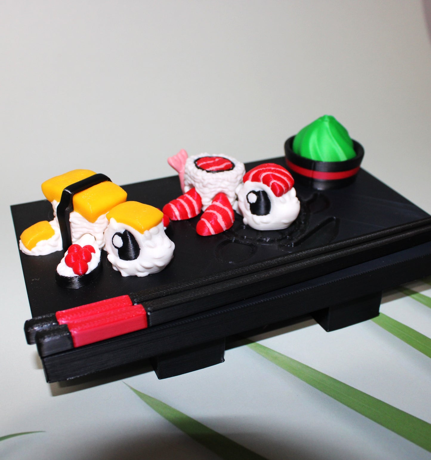 Sushi Turtles - Includes a tray, chopsticks, wasabi with bowl, one Tamago sushi turtle, and one Toro sushi turtle - 3D printed. - Wonderland 3D Printing