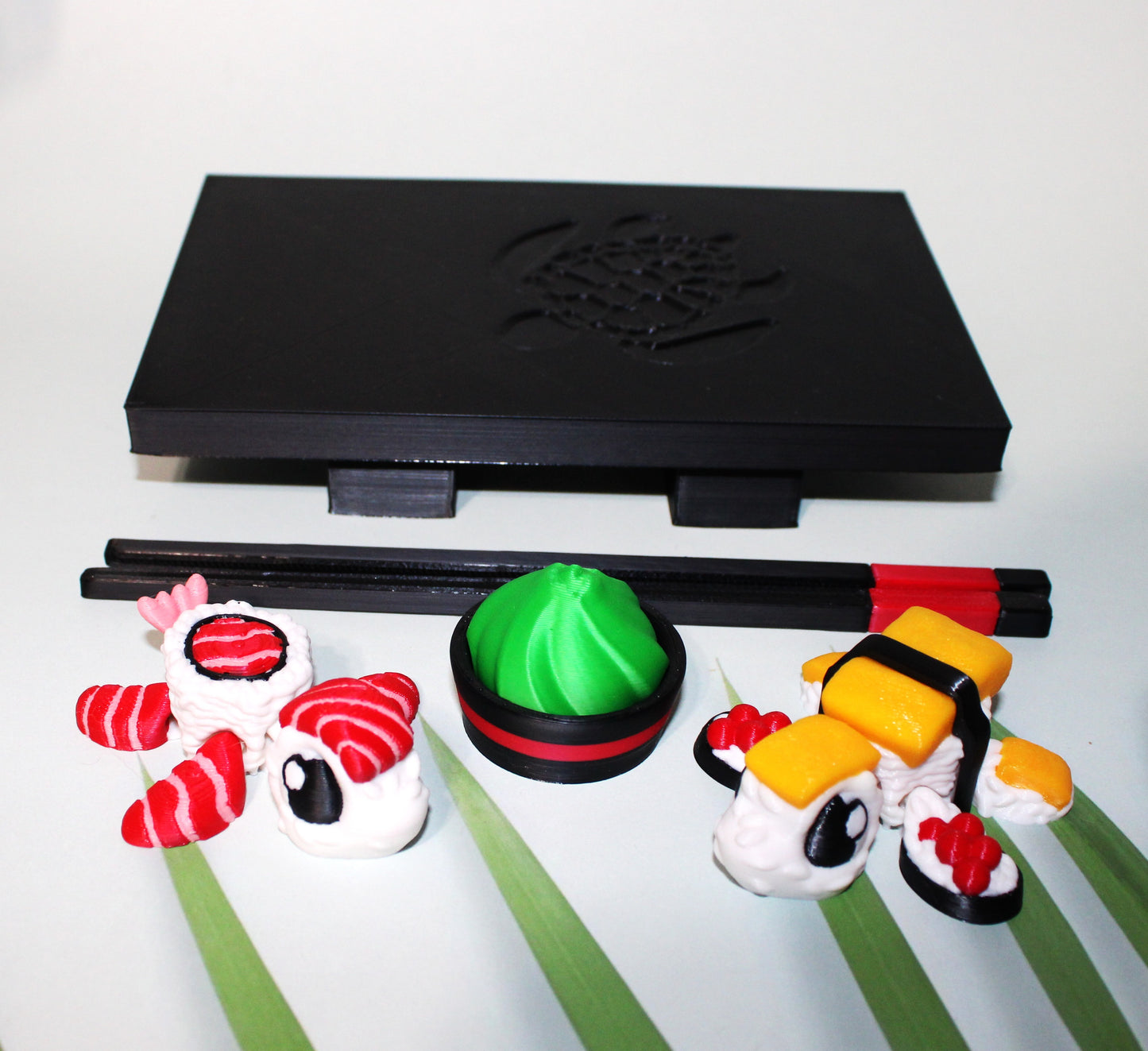 Sushi Turtles - Includes a tray, chopsticks, wasabi with bowl, one Tamago sushi turtle, and one Toro sushi turtle - 3D printed. - Wonderland 3D Printing