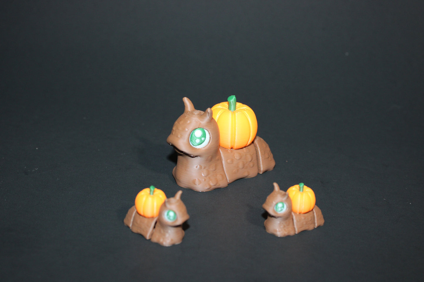 Spooky Snails all 3 included- 3D Printed Fidget Toy. 1 Pumpkin, 1 Cauldron, and 1 Skull - Wonderland 3D Printing