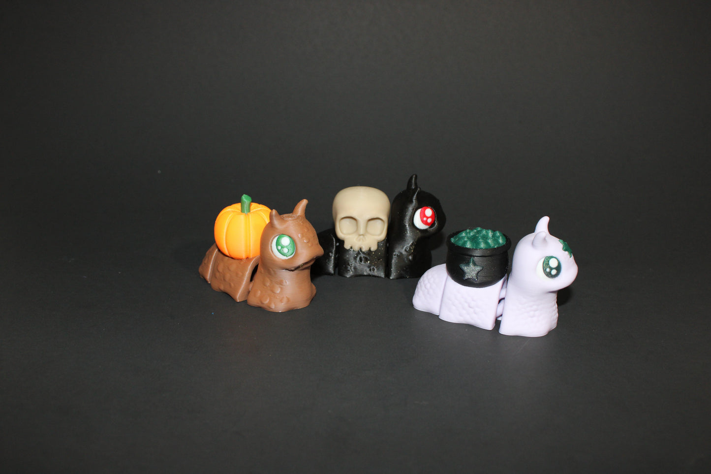 Spooky Snails all 3 included- 3D Printed Fidget Toy. 1 Pumpkin, 1 Cauldron, and 1 Skull - Wonderland 3D Printing