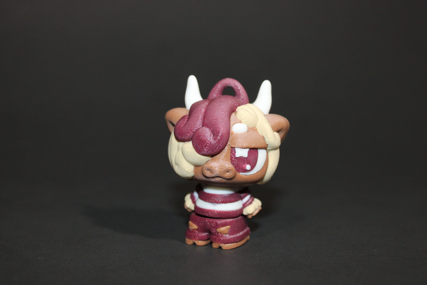 3D-printed Flexi Emo Cow with Guitar 2" Tall - Wonderland 3D Printing