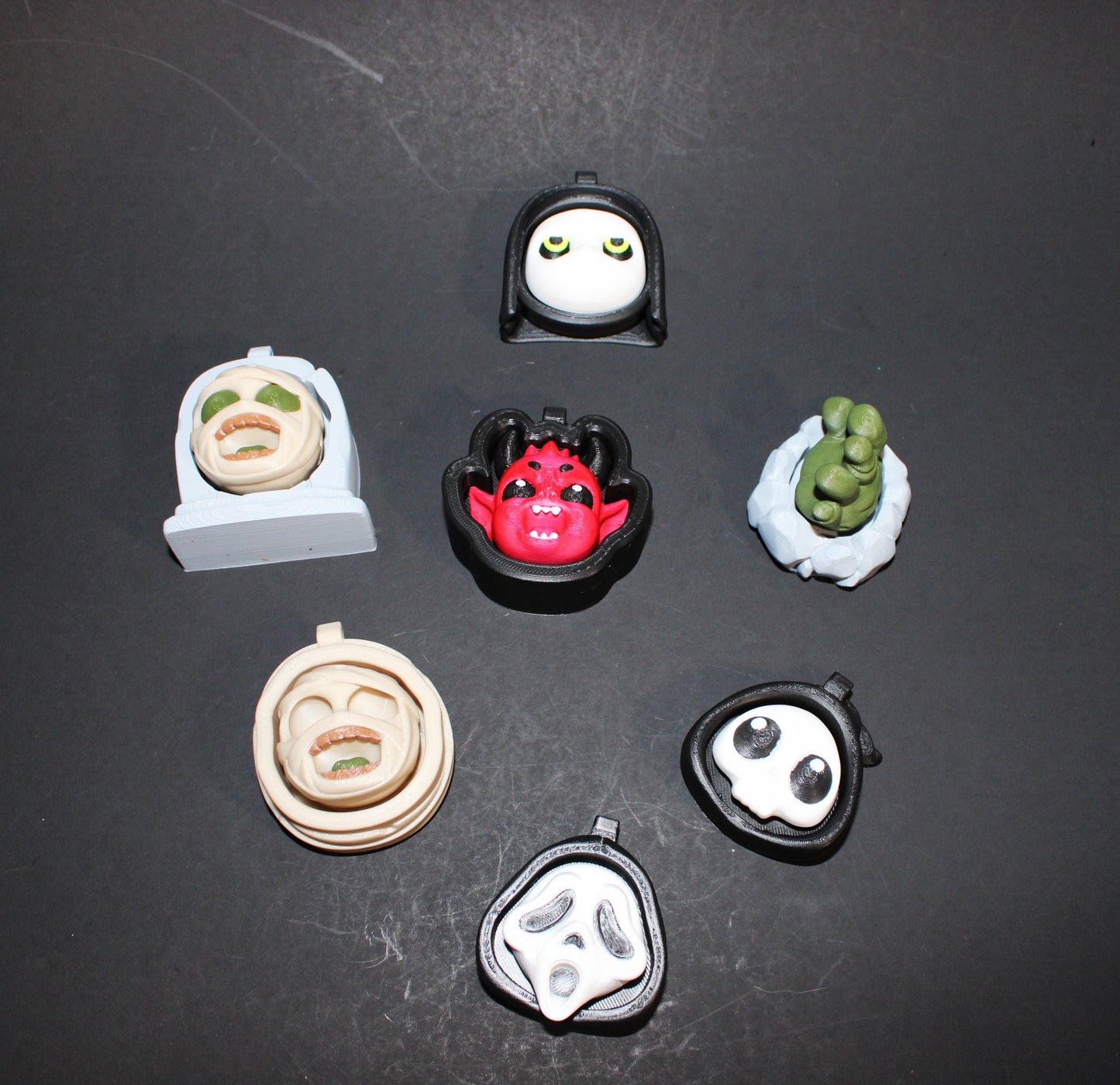 3D-printed Halloween keychain clickers, 2 inches.