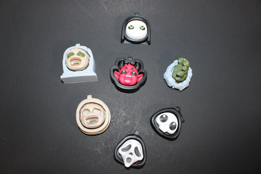 3D-printed Halloween keychain clickers, 2 inches.