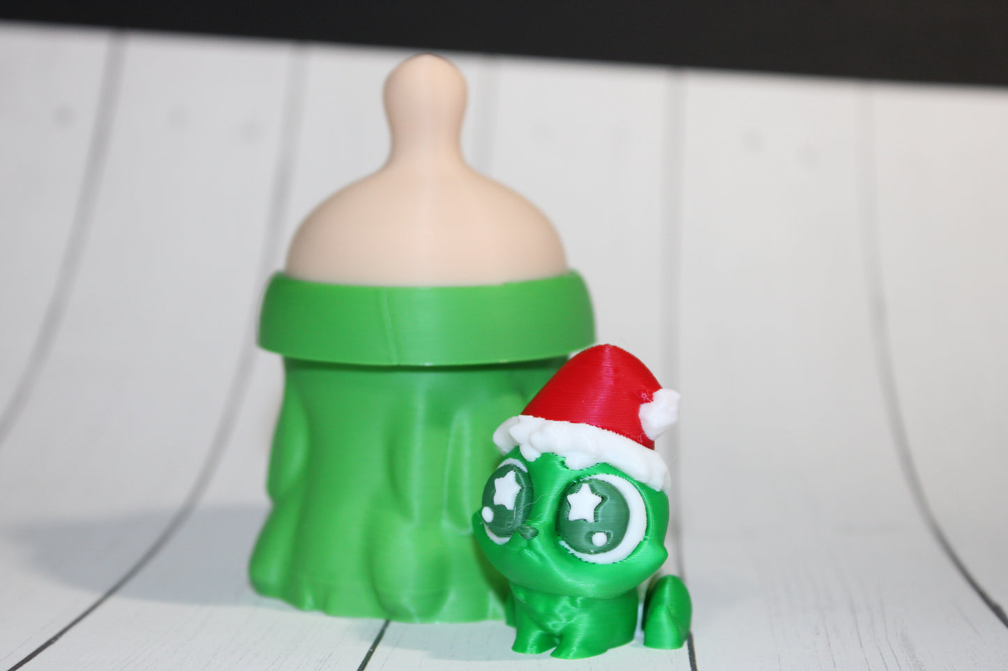 3D-printed Christmas Grumpy baby with Baby Bottle Container
