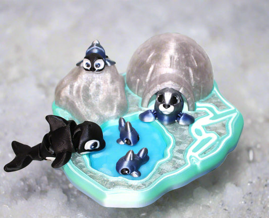 Toy set with penguins and an iceberg on a white background