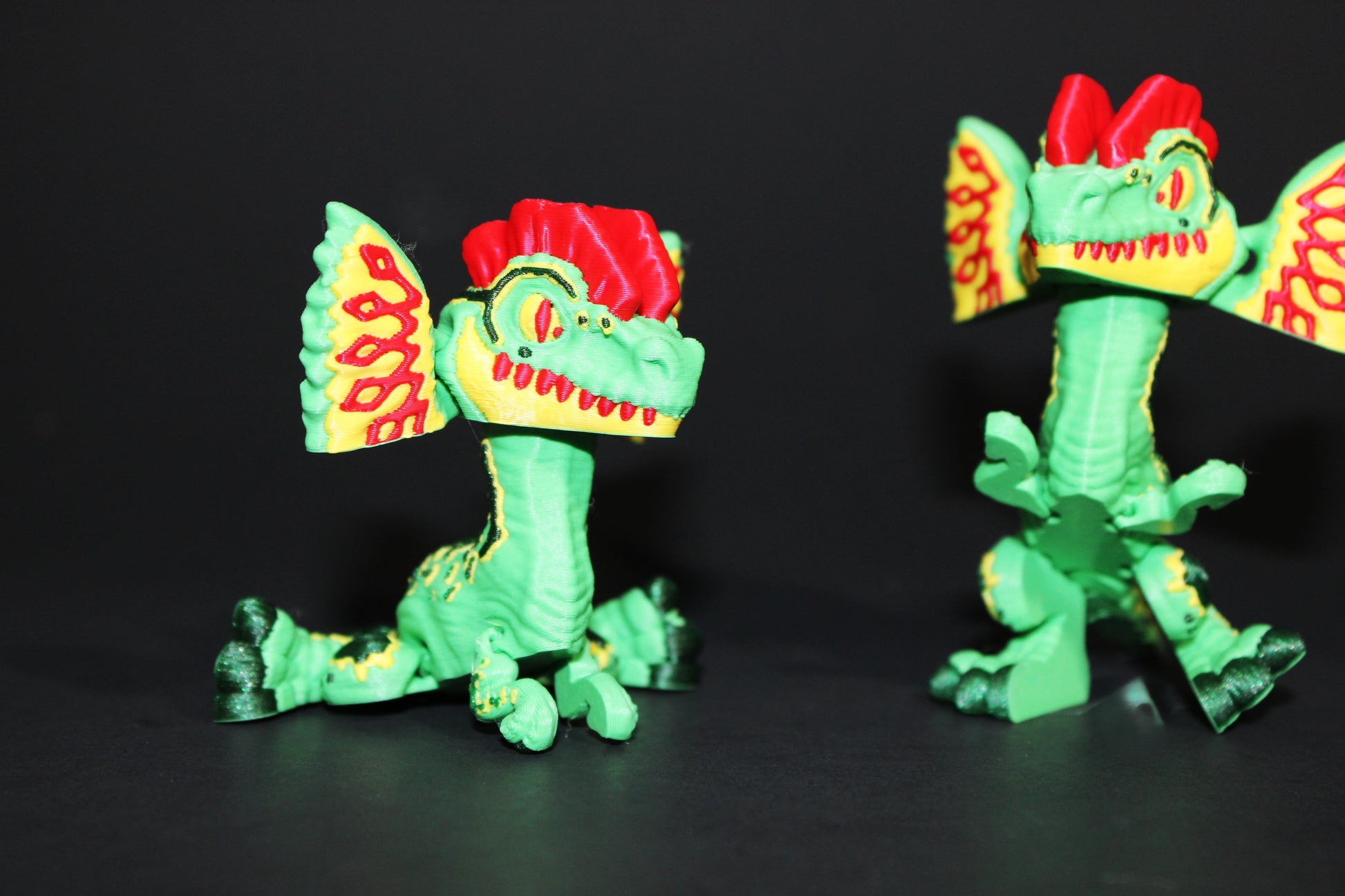 Mini 3D Printed Flexi Dilophosaurus Articulated 3.25 inches Tall - Wonderland 3D Printing 